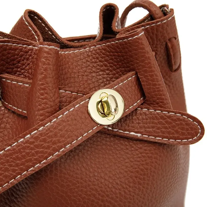A new modern casual bucket bag with a large capacity and an adjustable belt for the daily use of women