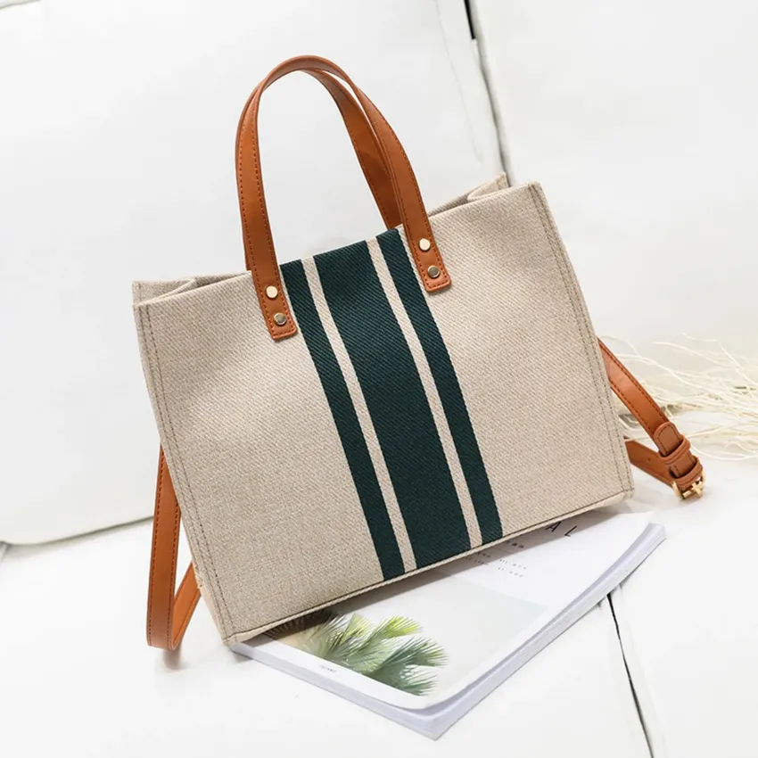 Women's handbag with large capacity as a simple crossover shoulder of fabric decorated with a bucket Women's handbag with large capacity as a simple crossover shoulder of fabric decorated with a bucket