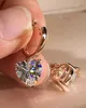 Witch gold color hop earrings of the shape of the zircon