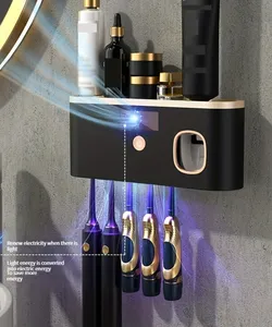 UV sterile toothbrush holder with automatic toothpaste distributor